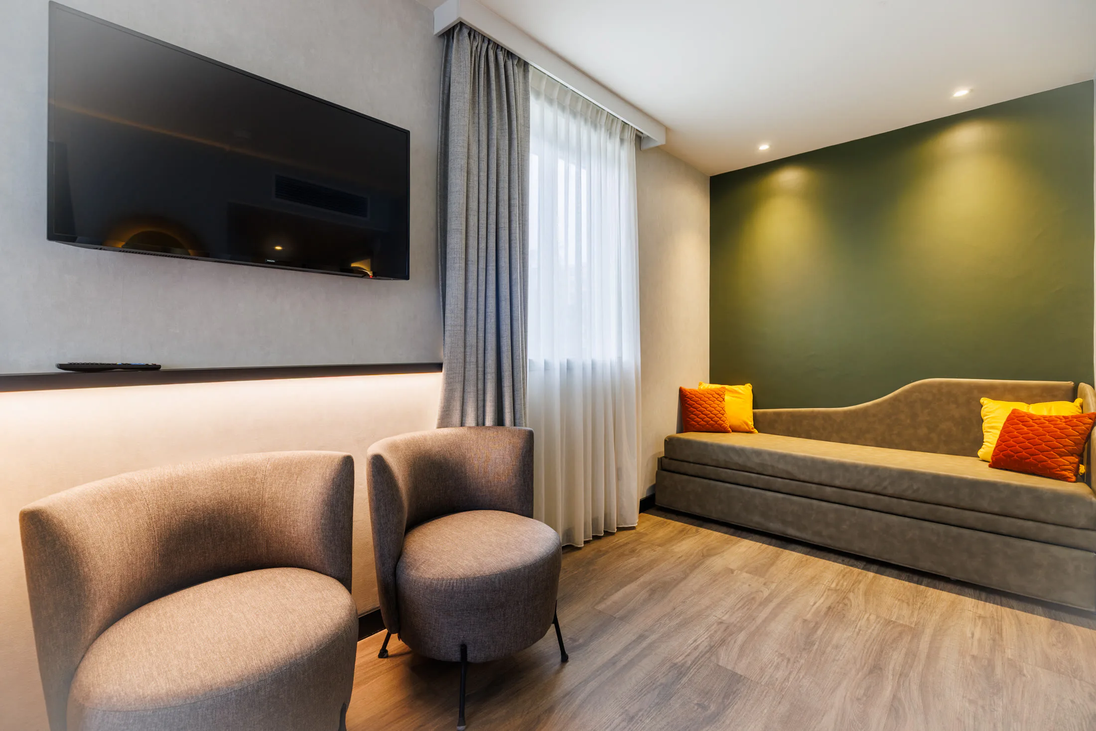 Chambre avec coin salon — Campanile Prime Lyon Part-Dieu